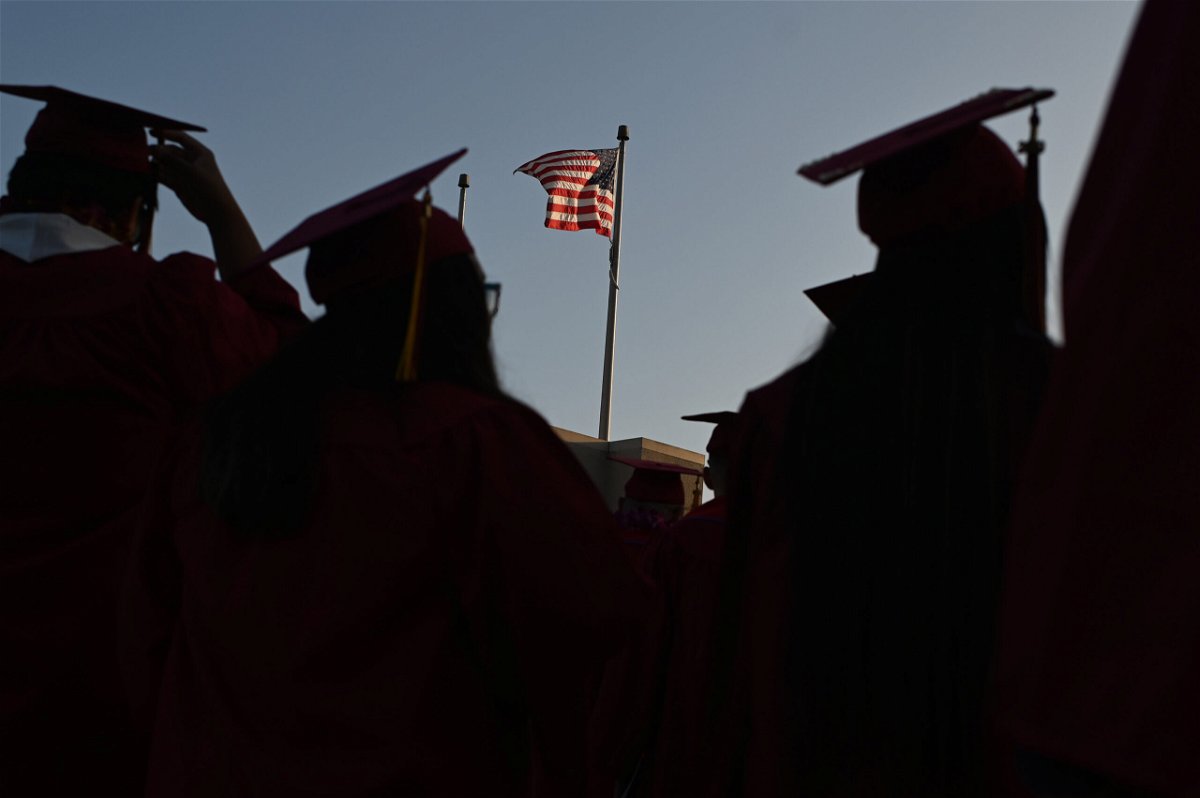 <i>ROBYN BECK/AFP/Getty Images</i><br/>The US Department of Education recently announced significant changes to a federal student loan forgiveness program. Students are seen graduating from Pasadena City College in June 2019.
