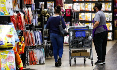 Halloween-themed masks are placed on sale at a shop as consumers have started their Halloween shopping early October in Chantilly