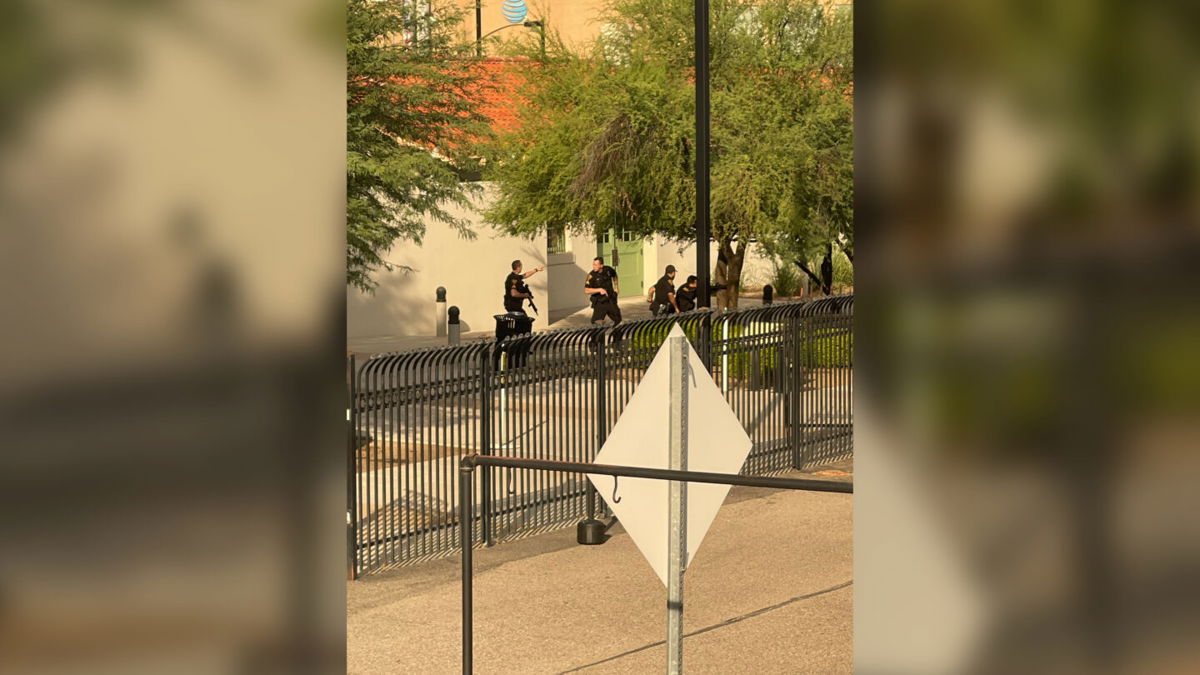 <i>Evan Courtney</i><br/>Evan Courtney shot this image of police responding to scene in Tucson