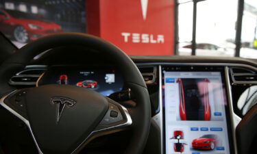 The inside of a Tesla vehicle is viewed as it sits parked in a new Tesla showroom and service center in Red Hook