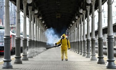 A worker disinfects Moscow's Belorussky railway station on October 20. Moscow will impose a 10-day lockdown from October 28 to November 7 in an effort to curb soaring Covid-19 cases