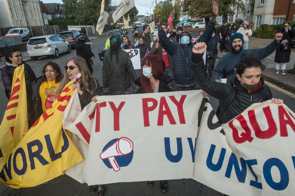 <i>Guy Smallman/Getty Images</i><br/>UK workers will be getting bigger paychecks starting in April following a hike to the minimum wage. Striking workers are seen here in London on October 21.