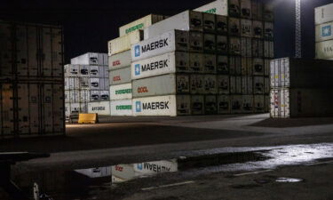 Shipping containers dockside in the evening at the Port of Rotterdam in Rotterdam