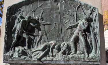 Pacific Islanders and their allies marched through downtown Spokane to amplify calls to remove a plaque on the base of the John R. Monaghan monument in Spokane