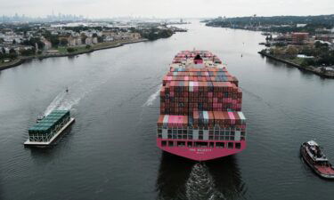 A cargo ship moves under the Bayonne Bridge as it heads out to the ocean on Oct. 6