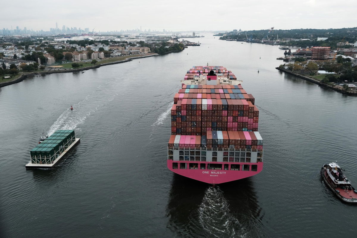 <i>Spencer Platt/Getty Images</i><br/>A cargo ship moves under the Bayonne Bridge as it heads out to the ocean on Oct. 6