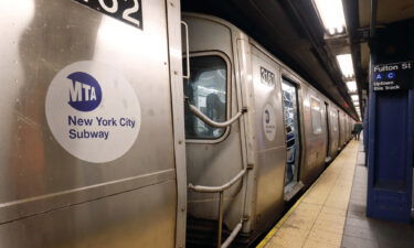 New York Mayor Bill de Blasio said Wednesday he was "troubled" by a video showing two unmasked NYPD officers removing a masked commuter from a subway station this week