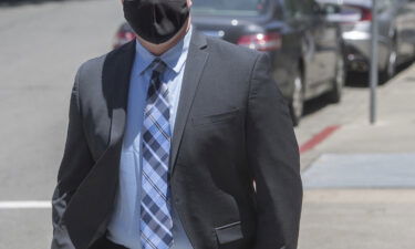 Contra Costa Sheriff's Deputy Andrew Hall walks into the A.F. Bray Courthouse for an arraignment in Martinez