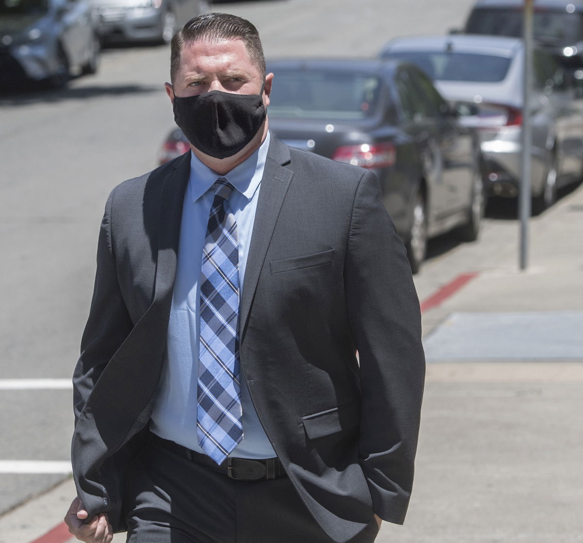 <i>Doug Duran/Bay Area News Group/AP</i><br/>Contra Costa Sheriff's Deputy Andrew Hall walks into the A.F. Bray Courthouse for an arraignment in Martinez