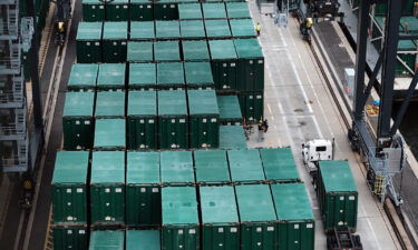 US business leaders are still upbeat about the economic recovery. But they're not as confident as they were just a few months ago. Containers from cargo ships are stacked at a port in Elizabeth on October 06