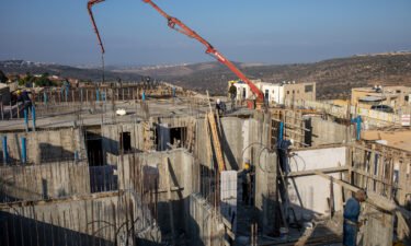 Palestinian laborers build new houses in the West Bank Jewish settlement of Bruchin on Monday
