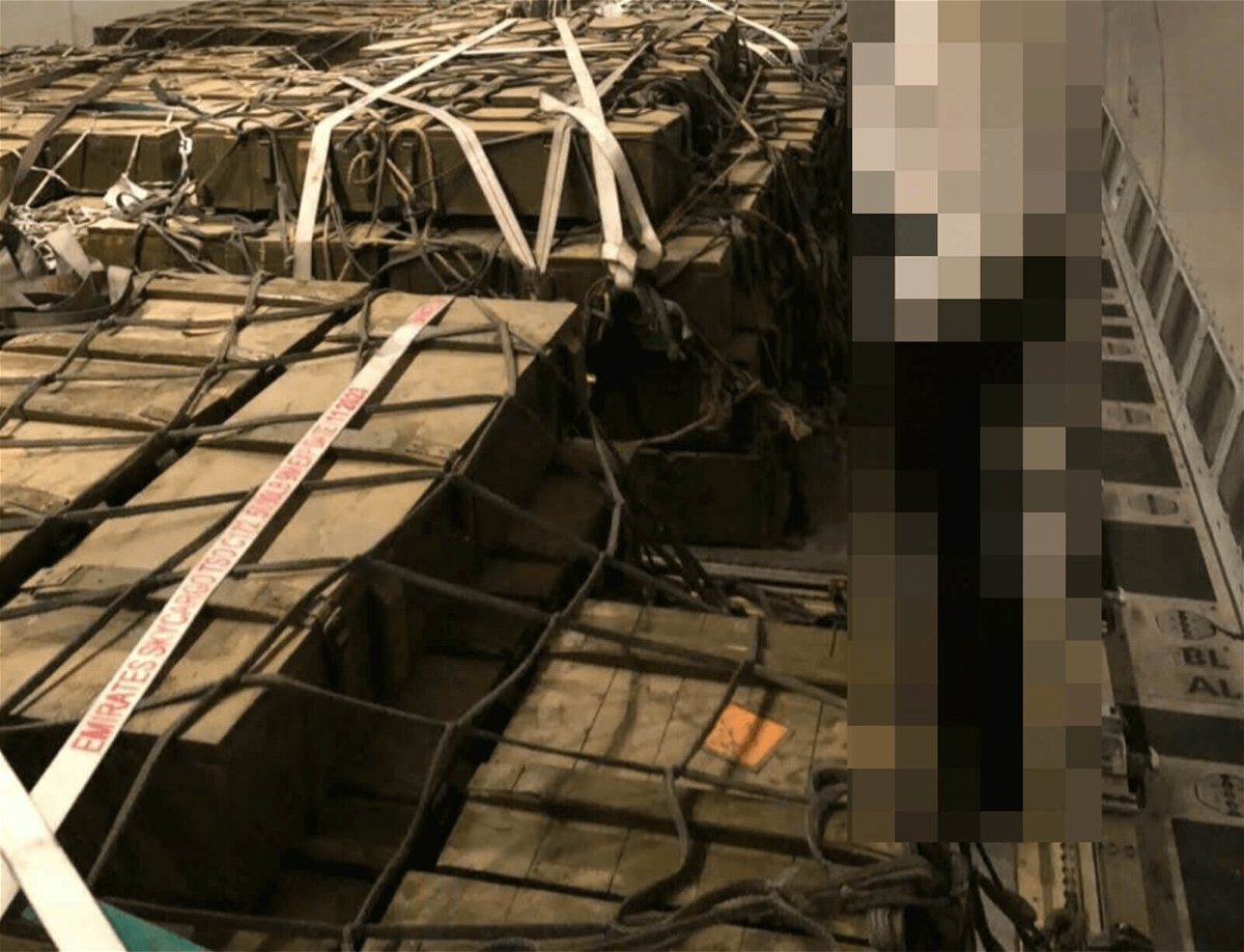 <i>Obtained by CNN</i><br/>This photo shows crates of munitions on board an Ethiopian Airlines flight last November. A person wearing an airline uniform has been blurred by CNN to preserve anonymity.