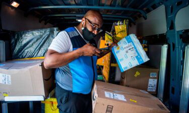 Amazon has begun rolling out "Black Friday-worthy deals" to jumpstart the holiday shopping season. Amazon driver Shawndu Stackhouse is shown delivering packages in Northeast Washington
