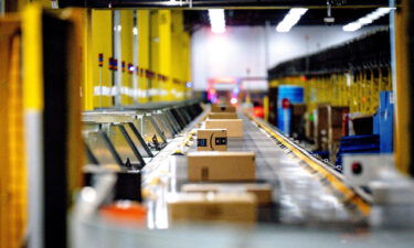 Packages move along a conveyor at Amazon fulfillment center in Eastvale on Tuesday