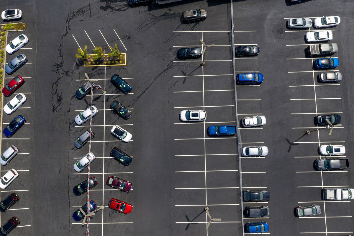 <i>David Paul Morris/Bloomberg/Getty Images</i><br/>Car sales at major automakers are plunging due to a shortage of computer chips that's forced factory shutdowns and crimped supply. Vehicles in a nearly empty lot at a car dealership in Richmond