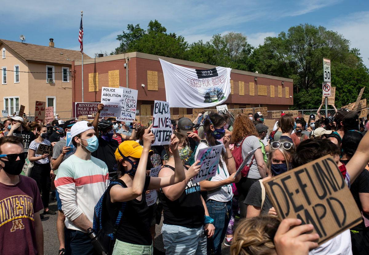 <i>Stephen Maturen/Getty Images</i><br/>Demonstrators marching to defund the police in June 2020 in Minneapolis