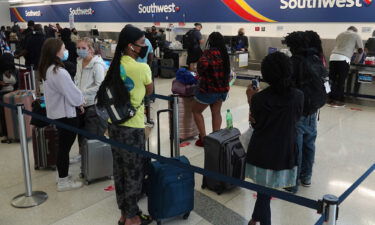 Passengers wait in line at the Southwest Airlines ticket counter at Fort Lauderdale Hollywood International Airport