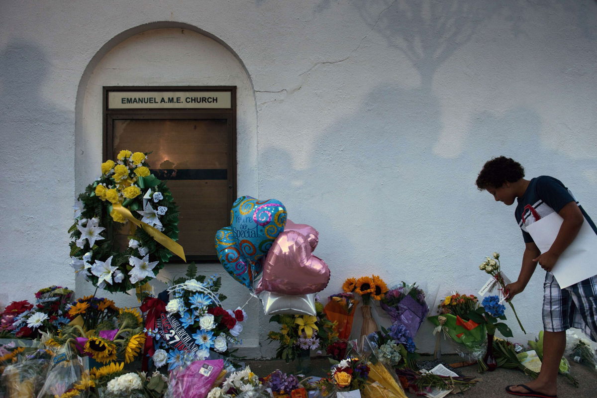 <i>Brendan Smialowski/AFP/Getty Images</i><br/>Families of the Charleston church massacre victims have reached a settlement with the Justice Department. Landon Whitchlock