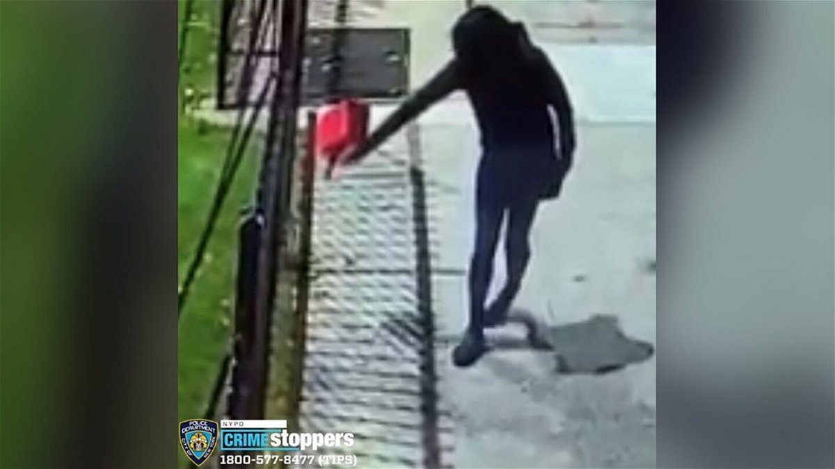 <i>NYPD</i><br/>Surveillance video shows a woman pouring gasoline outside of Yashiva of Flatbush on October 14