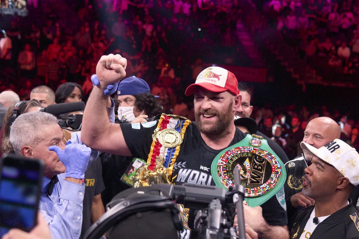<i>Erick W. Rasco/Sports Illustrated/Getty Images</i><br/>Tyson Fury wears his championship belts after defeating Wilder earlier this year.