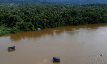 The drowning of two young boys in a river in the Brazilian state of Roraima has local community leaders asking if illegal mining played a role. A gold dredge is seen at the banks of Uraricoera River in the heart of the Amazon rainforest