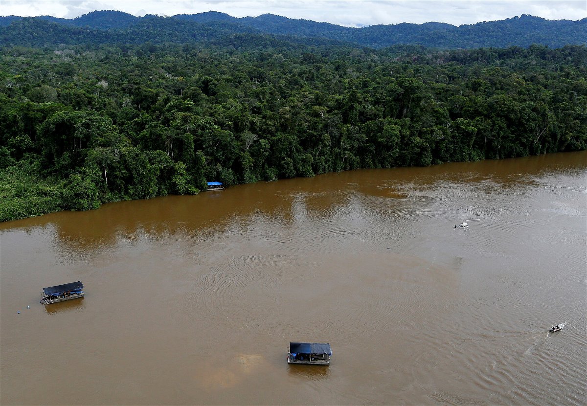 <i>Bruno Kelly/Reuters</i><br/>The drowning of two young boys in a river in the Brazilian state of Roraima has local community leaders asking if illegal mining played a role. A gold dredge is seen at the banks of Uraricoera River in the heart of the Amazon rainforest