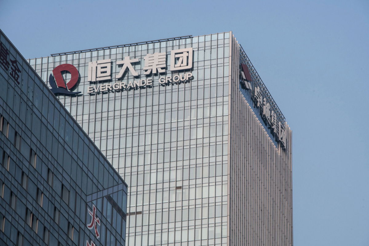 <i>Gilles Sabrie/Bloomberg/Getty Images</i><br/>The China Evergrande Group logo displayed atop the company's headquarters in Shenzhen