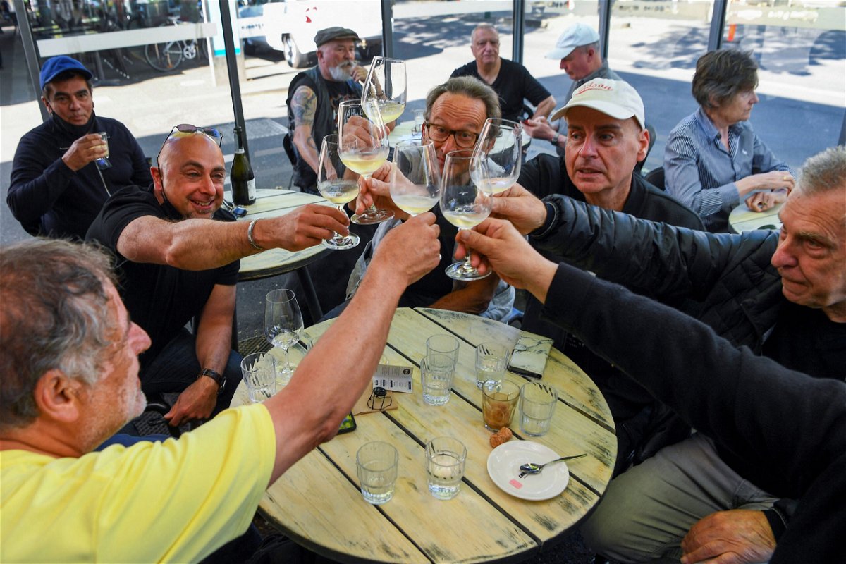 <i>William West/AFP/Getty Images</i><br/>People enjoy a drink at a busy Lygon Street cafe in Melbourne on October 22