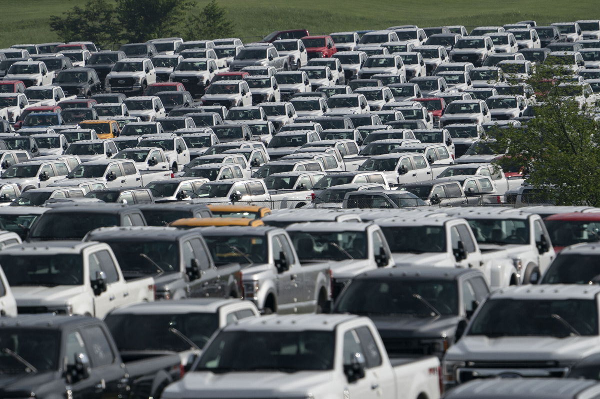 <i>Jeffrey Scott Dean/Bloomberg/Getty Images</i><br/>New Ford F-Series pickup trucks are stored in a lot during a semiconductor shortage at Kentucky Speedway in Sparta