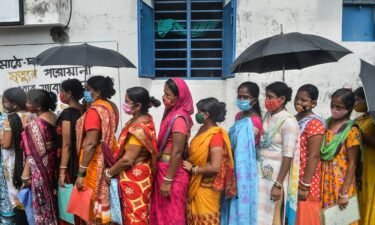 Women stand in a queue as they wait to receive a dose of the Covishield vaccine against the Covid-19 at a primary health centre in Siliguri on Aug. 2.