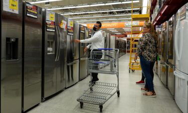 A customer looks at appliances for sale at a BrandsMart USA store on October 08