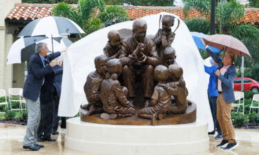 A statue honoring TV host Fred Rogers is unveiled on October 28 at Rollins College.