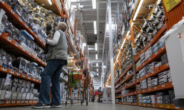 Walmart may be delivering the next power drill or can of paint you order from Home Depot. Customers are shown shopping for items at a Home Depot store in Pleasanton