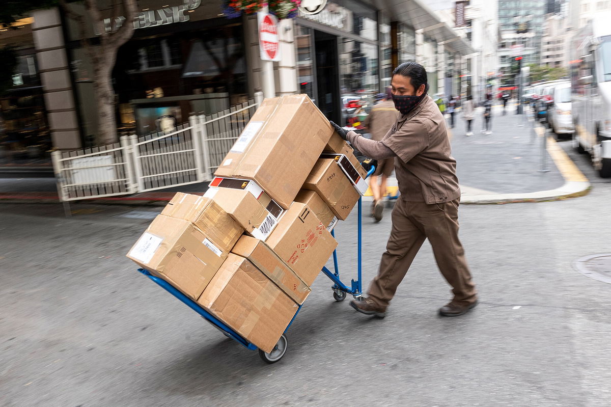 <i>David Paul Morris/Bloomberg/Getty Images</i><br/>UPS just posted its best year ever. A UPS driver delivers packages in San Francisco in July.