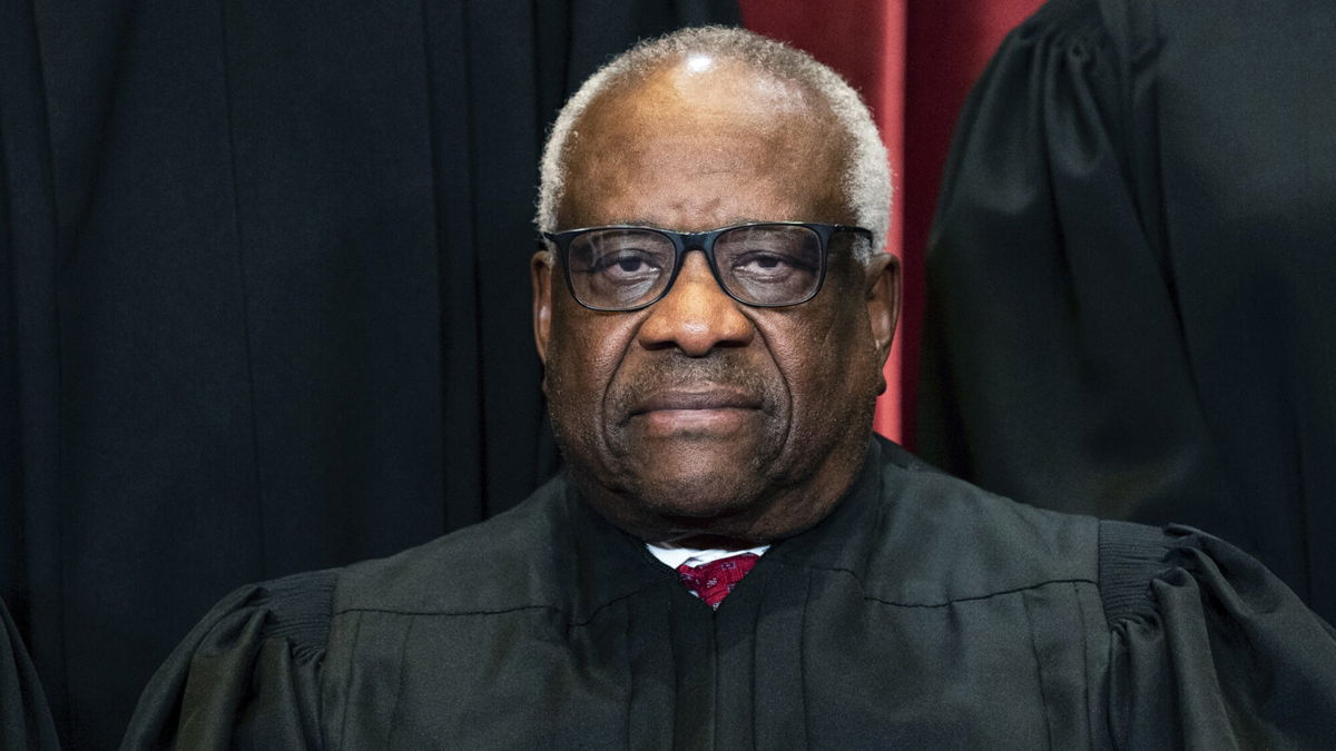 <i>Erin Schaff/The New York Times/Pool</i><br/>Associate Justice Clarence Thomas sits during a group photo at the Supreme Court in Washington
