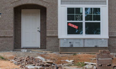 A "Sold" sign in the window of a home under construction in the Ellerbe Estates subdivision in Dalzell