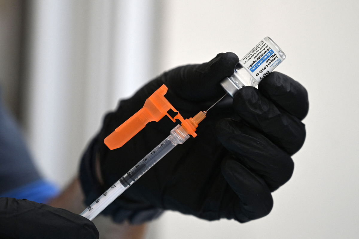 <i>Robyn Beck/AFP/Getty Images</i><br/>Johnson & Johnson said Tuesday it has asked the US Food and Drug Administration to authorize booster shots for its coronavirus vaccine. A nurse fills a syringe with Johnson & Johnson's Janssen Covid-19 vaccine in Pasadena
