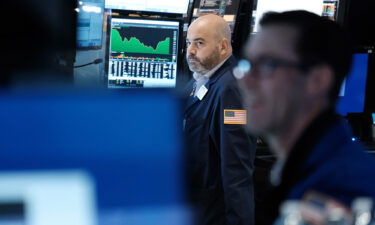 Traders work on the floor of the New York Stock Exchange (NYSE) on October 25 in New York City.