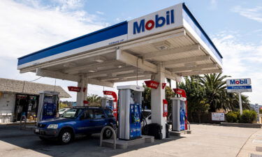 Vehicles at fuel pumps at Exxon Mobil gas station in San Pablo