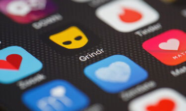 The Grindr app logo on a mobile phone