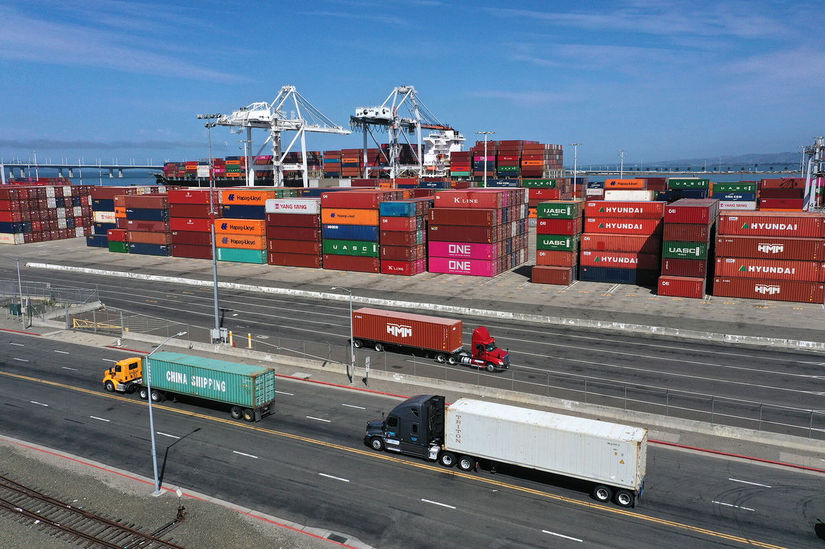 <i>Justin Sullivan/Getty Images</i><br/>America's economic recovery hits a major roadblock this summer. Shipping containers sit in dock at the Port of Oakland on September 09