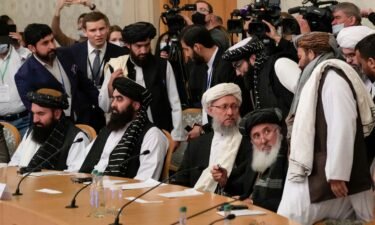 Deputy Prime Minister of Afghanistan's interim government Abdul Salam Hanafi (center) and members of the Taliban delegation attend an international conference on Afghanistan in Moscow on October 20.