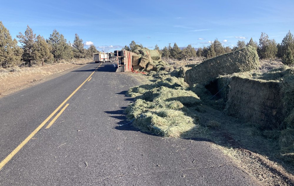 Hay truck overturned, spilled its load Saturday on SW Reservoir Road