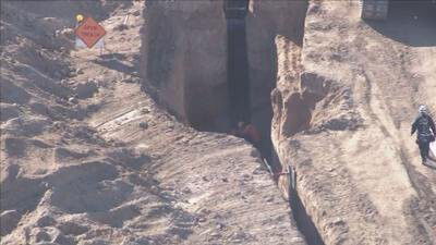 <i>KTVK/KPHO</i><br/>Firefighters from several cities worked together to rescue two workers who got stuck in a trench at a construction site in Scottsdale on November 1.