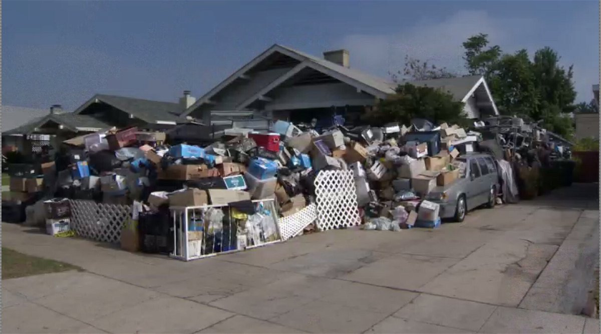 <i>KCBS / KCAL</i><br/>The 8-foot wall of junk contains items like old doors