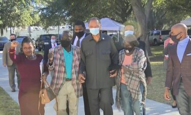 Noted civil rights leader the Rev. Jesse Jackson arrives at Monday's court proceedings in a show of support for the Arbery family.