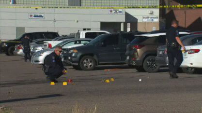 <i>KCNC</i><br/>Police investigate the scene where six teeneragers who shot and injured near Aurora Central High School last week.
