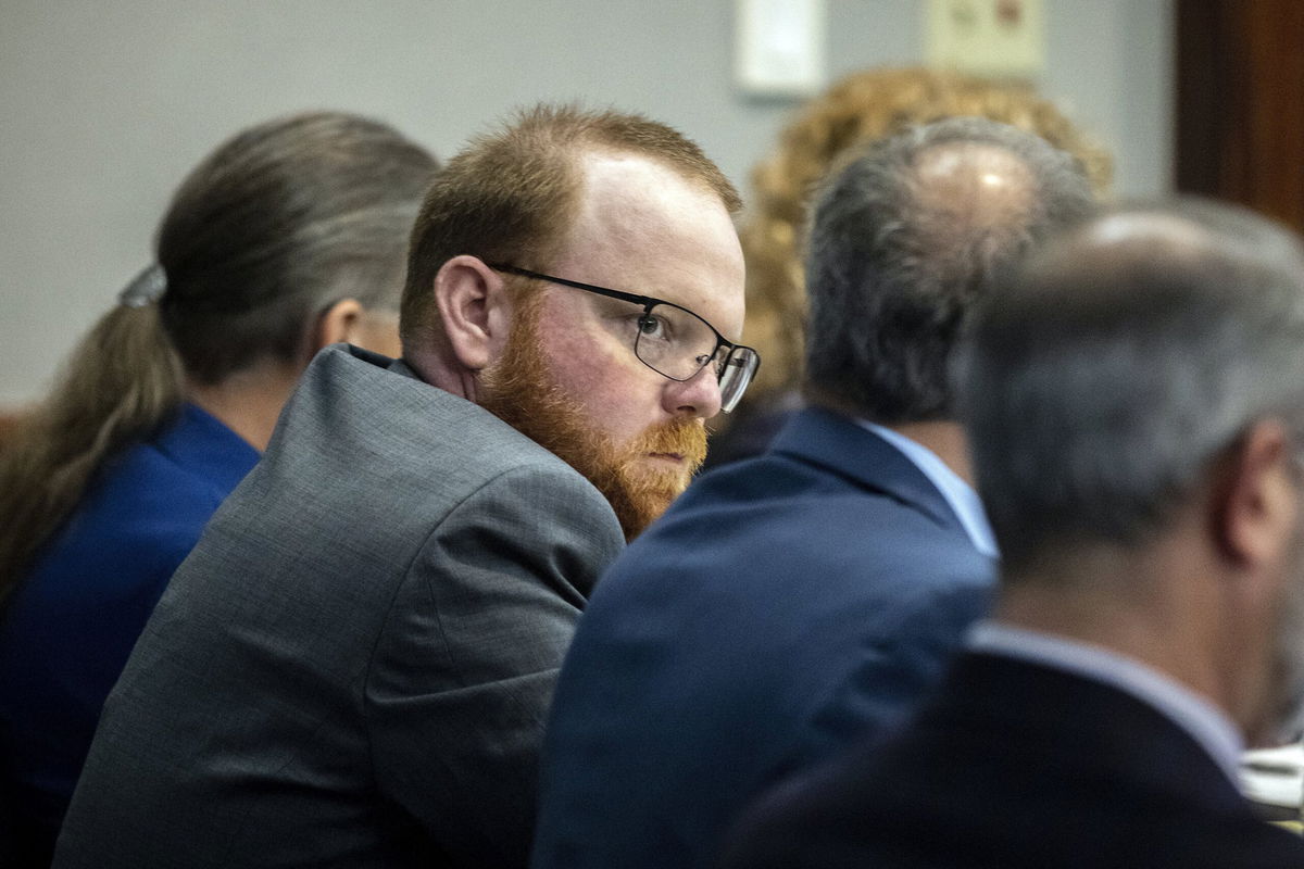 <i>Pool/AP</i><br/>Travis McMichael listens to testimony in the Ahmaud Arbery killing trial.