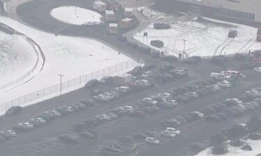 First response vehicles are seen in the parking lot of Oxford High School where a suspected school shooting was reported and a suspected shooter is in custody