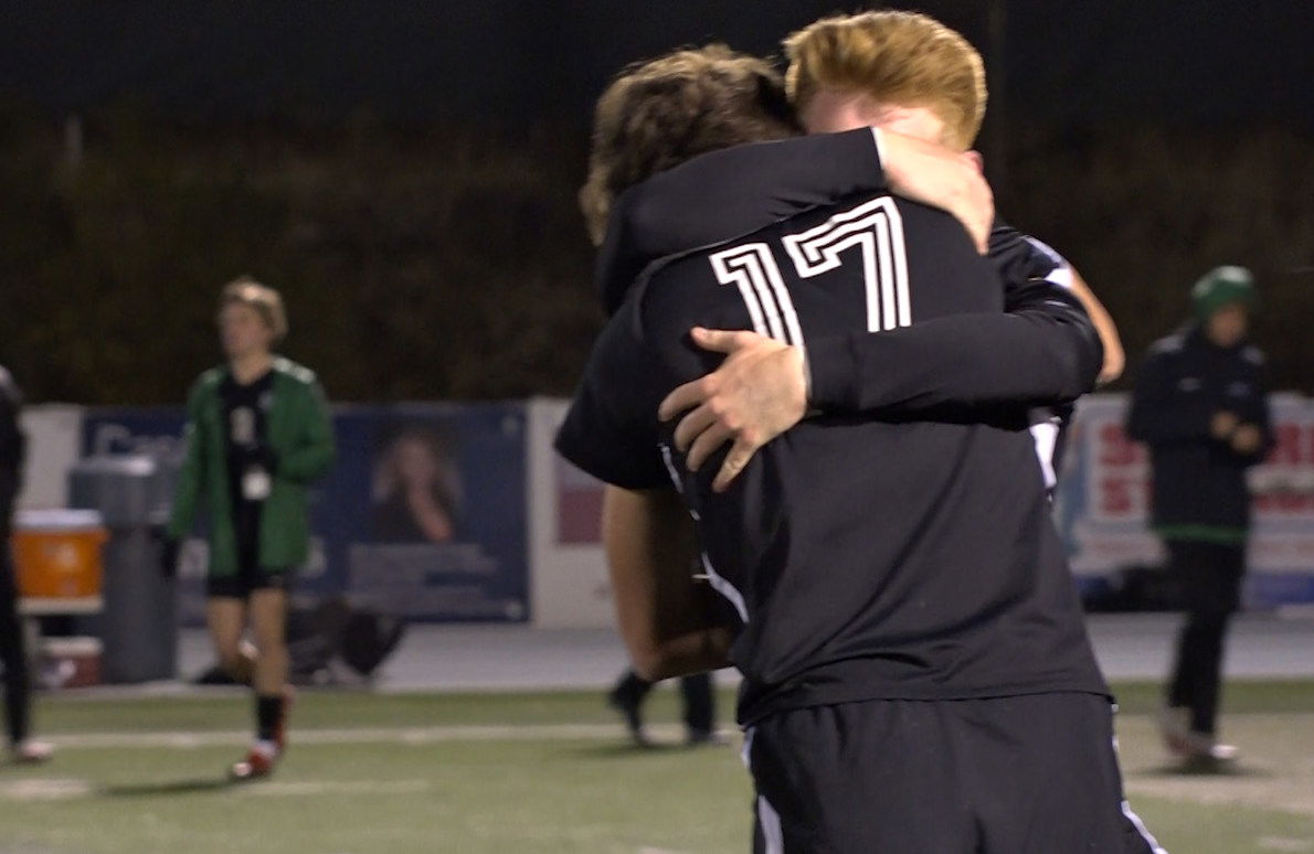 Summit seniors Rory McKee and Alex Grignon (17) embrace Tuesday after the Storm boy's soccer team secures its spot in the 6A state title game